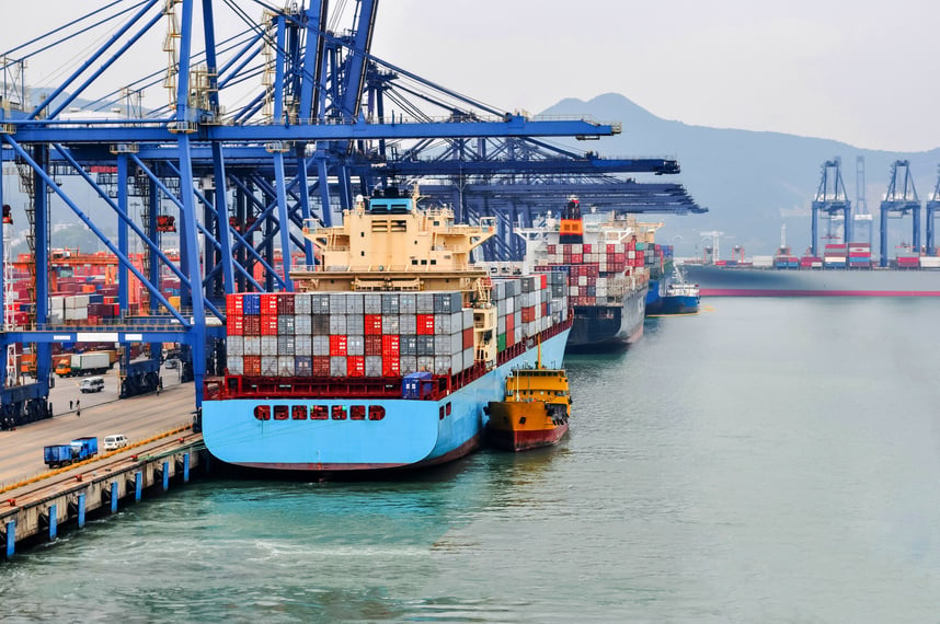 Container ship in port at container terminal Port Shenzhen, China. Ships of container ships stand in terminal of port on loading, unloading container