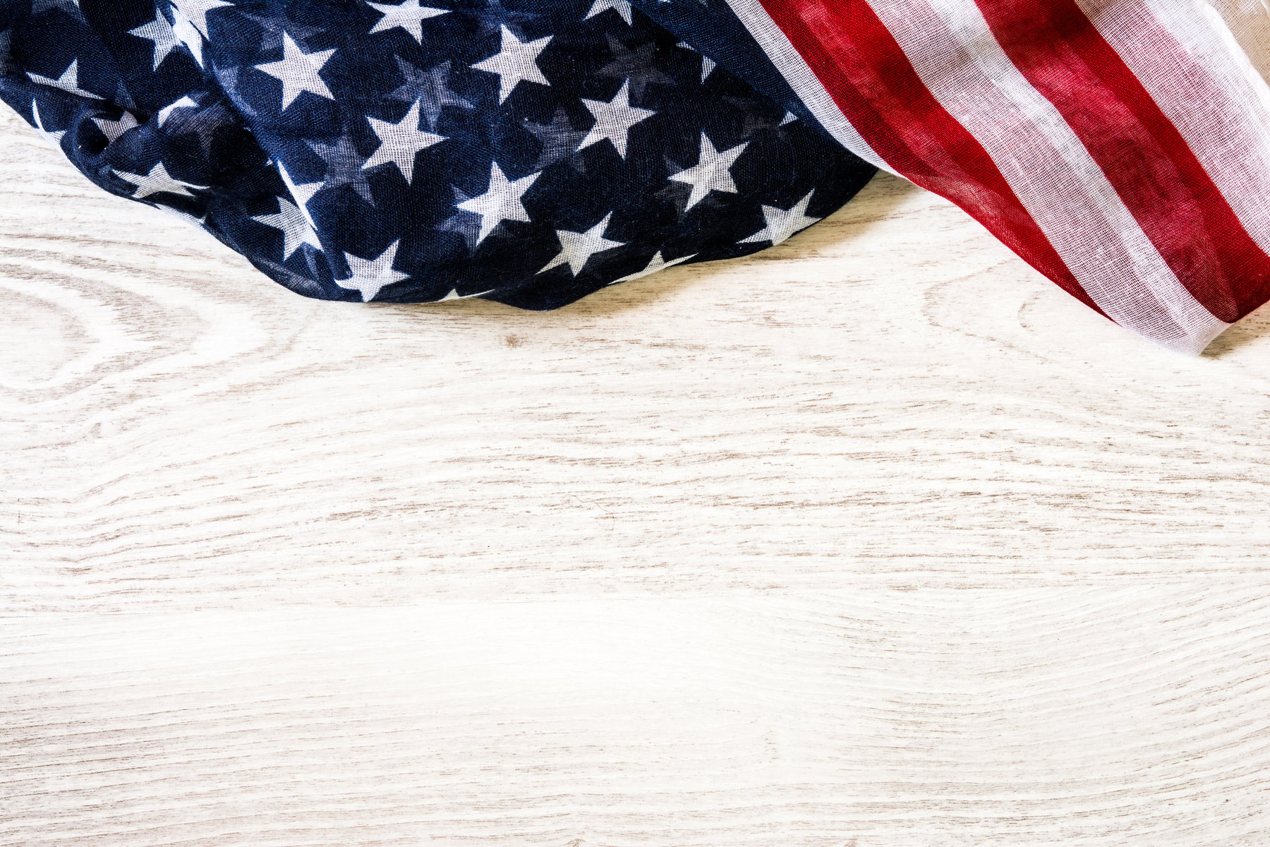 United States flag on white  wooden background. Copyspace