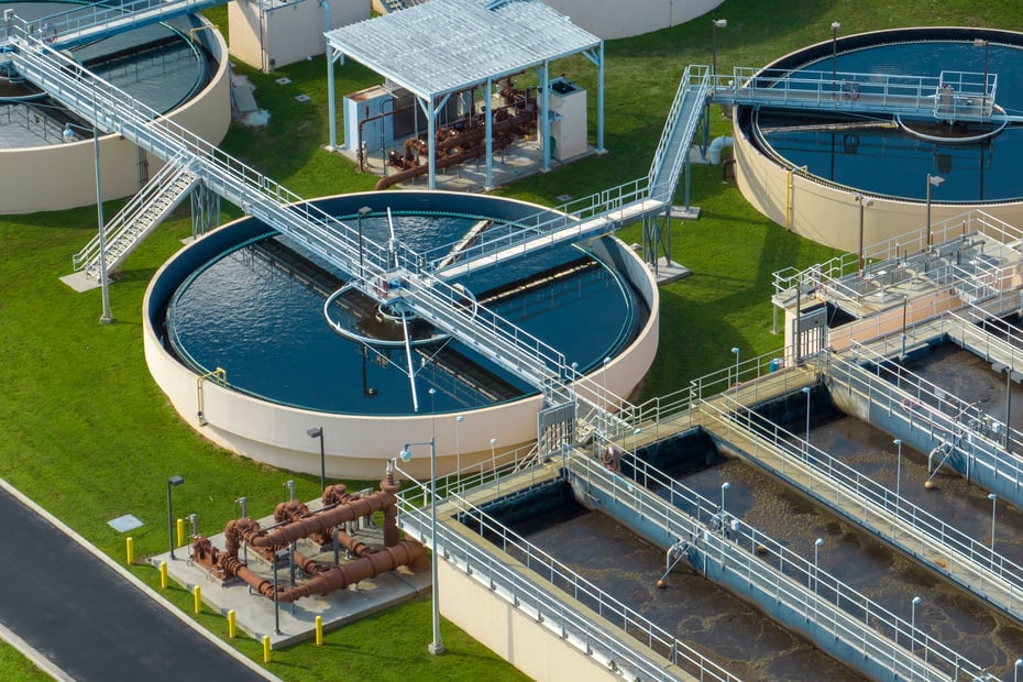 Aerial view of modern water cleaning facility at urban wastewater treatment plant. Purification process of removing undesirable chemicals, suspended solids and gases from contaminated liquid