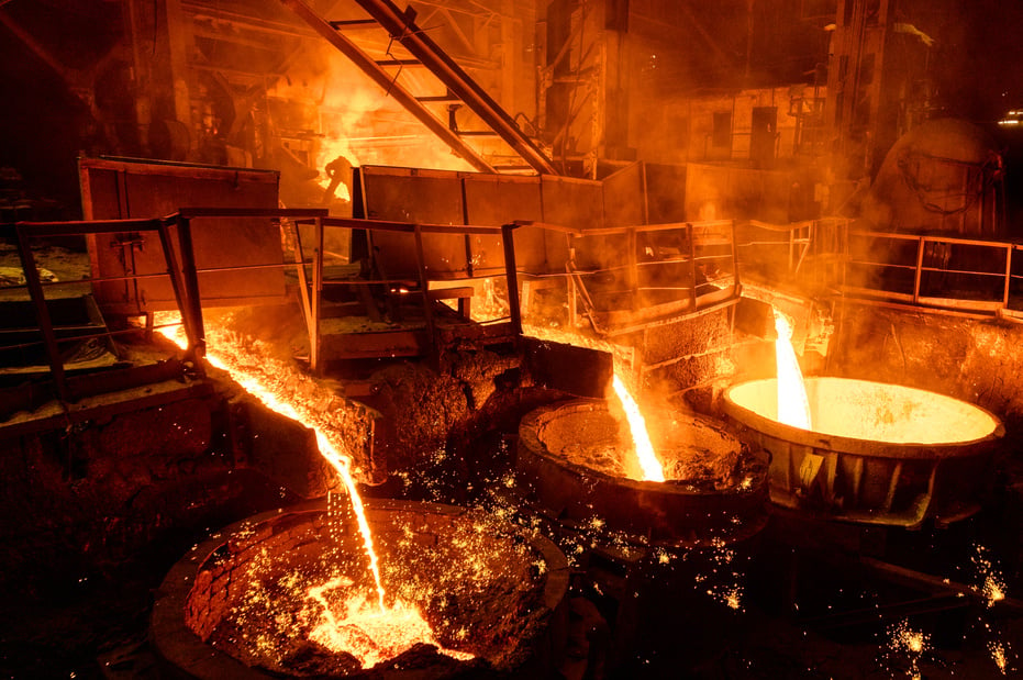 Blast furnace slag and pig iron tapping. Molten metal and slag are poured into a ladle